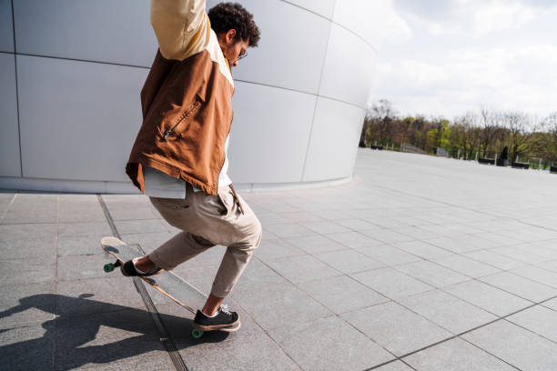 istock African american man makes jump on his skateboard 1171885240