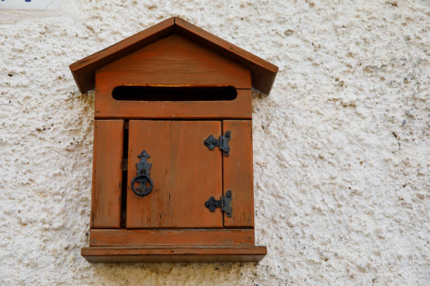 istock Old wooden mailbox hanging on the wall. 1171885633