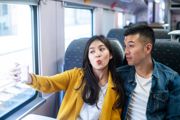 istock Couple taking selfie in the train 1171885758