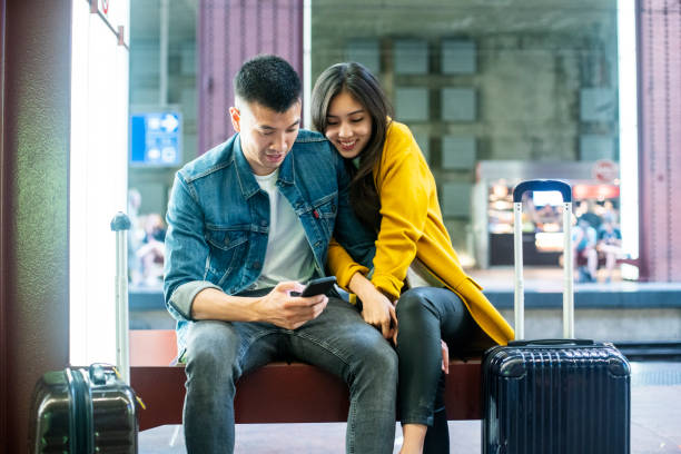 istock Couple navigating on the mobile phone at Antwerp Central station 1171886426