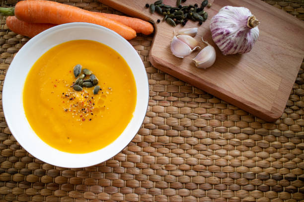 istock Vegetable cream with garlic and carrots on a table 1171886903