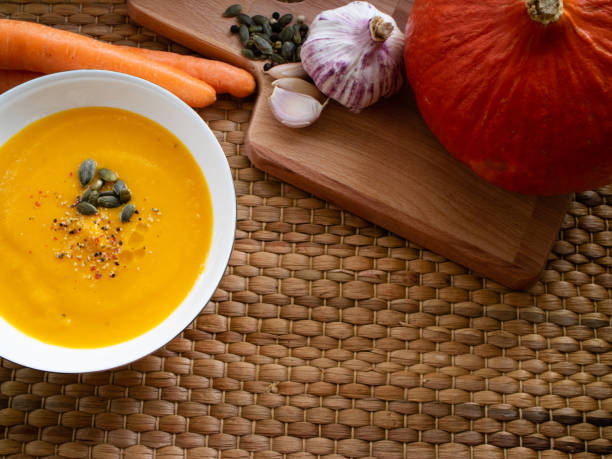 istock Carrot soup with garlic and pumpkin decorating 1171887188