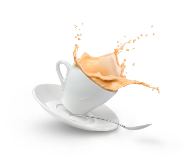 istock milk coffee splash in white cup isolated 1171889248
