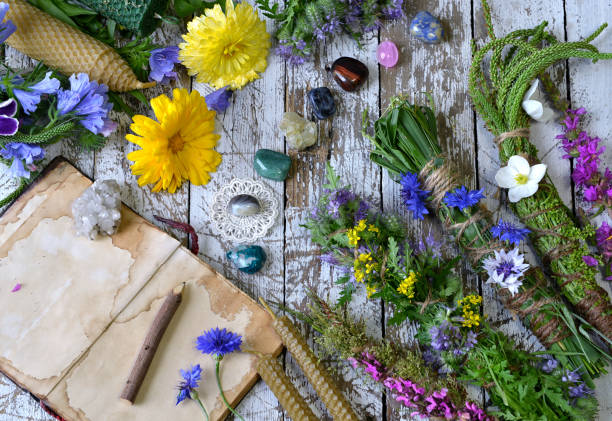 istock Still life with calendula flowers, herbs, reiki crystals on witch table. 1171889252