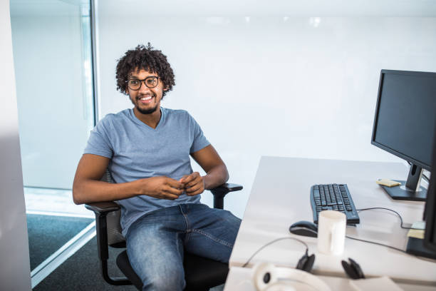 istock Happy African American programmer working in the office. 1171889609