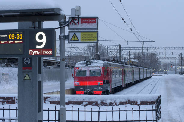 istock Electric train near the snow-covered platform number 9 1171890666