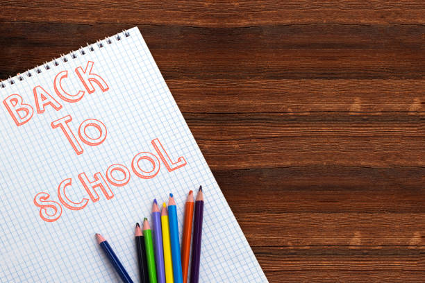 istock back to school concept, empty notebook and colorful pencil 1171892011