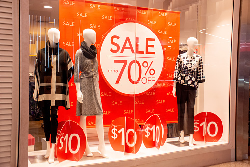 70% off sales promotion on retail shop display window. Black Friday, Clearance, Mega sale