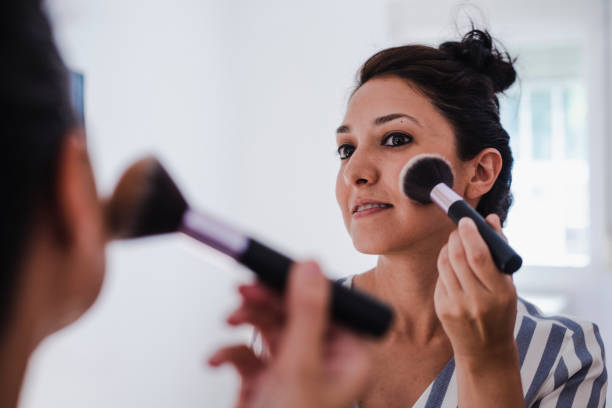 istock Young Latina putting on makeup 1171893527