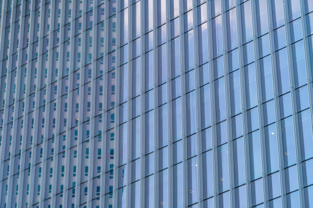 istock Office buildings windows. Blue glass architecture facade design with reflection of sky in urban city, Downtown Singapore City in financial district. 1171895023