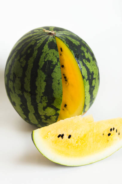 istock ripe yellow watermelon and sliced watermelon on white background 1171895643