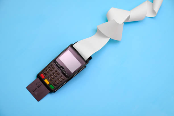 Credit card terminal on a blue background stock photo
