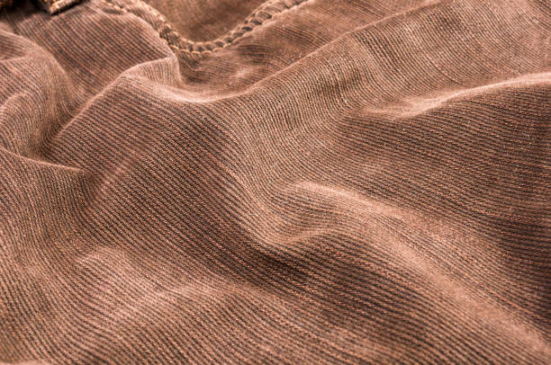 istock clothing items stonewashed cotton fabric texture with seams, clasps, buttons and rivets, macro 1171896739