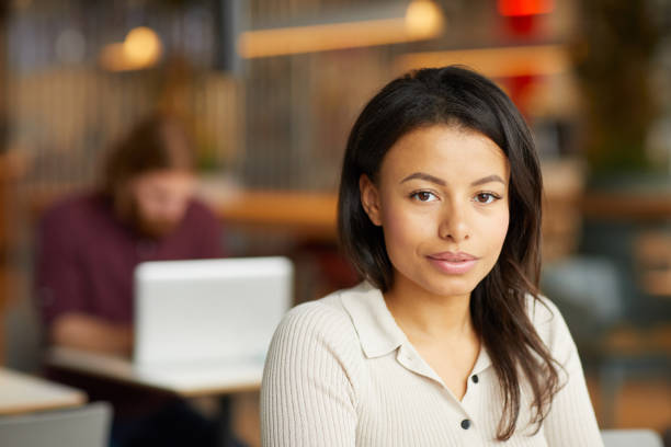 istock Beautiful young woman in cafe 1171897356