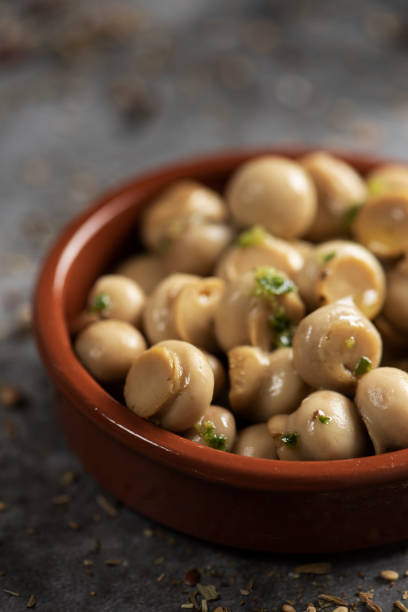 istock mini mushrooms cooked with garlic and parsley 1171899839