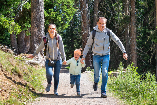istock Family Running In Forest 1171903601