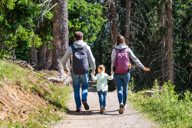 istock Family Running In Forest 1171903611