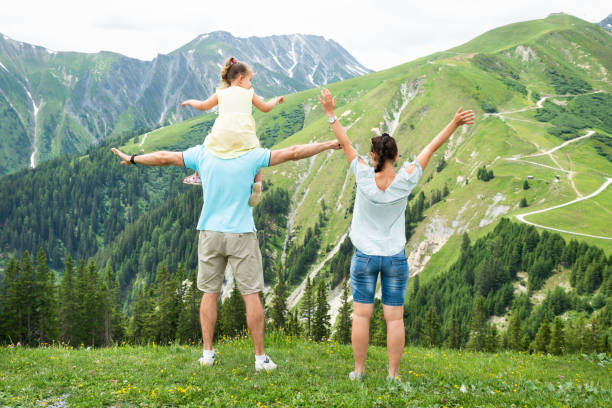 istock Happy Family Looking At Panoramic View 1171903670