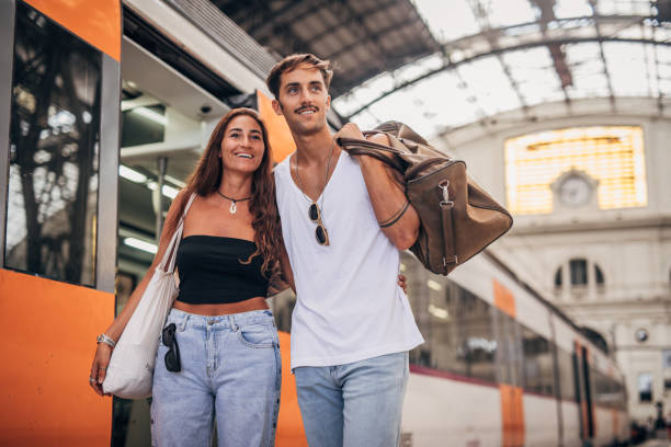 istock Modern couple on train station together 1171905936