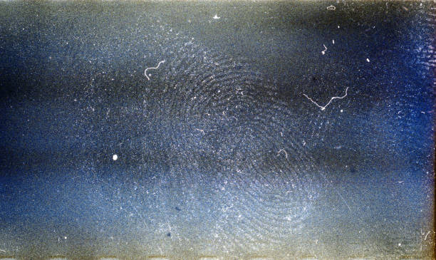 Blank grained film strip texture background with heavy grain, dust fingerprint and newton's rings