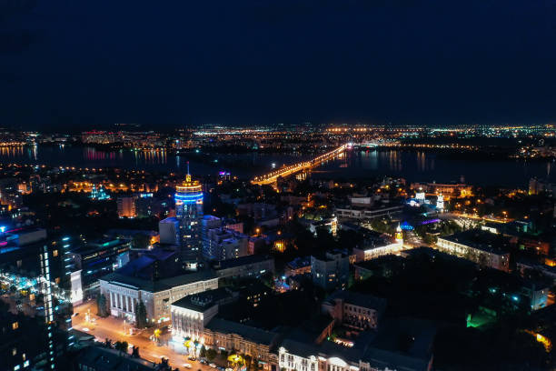 istock Night City Voronezh downtown or center panorama from above with illuminated road intersection, car traffic, modern business and residential buildings 1171906531