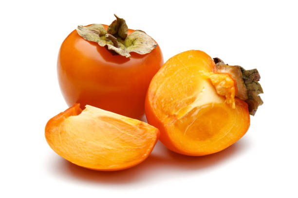 istock Whole and sliced ripe persimmon fruits isolated 1171908685