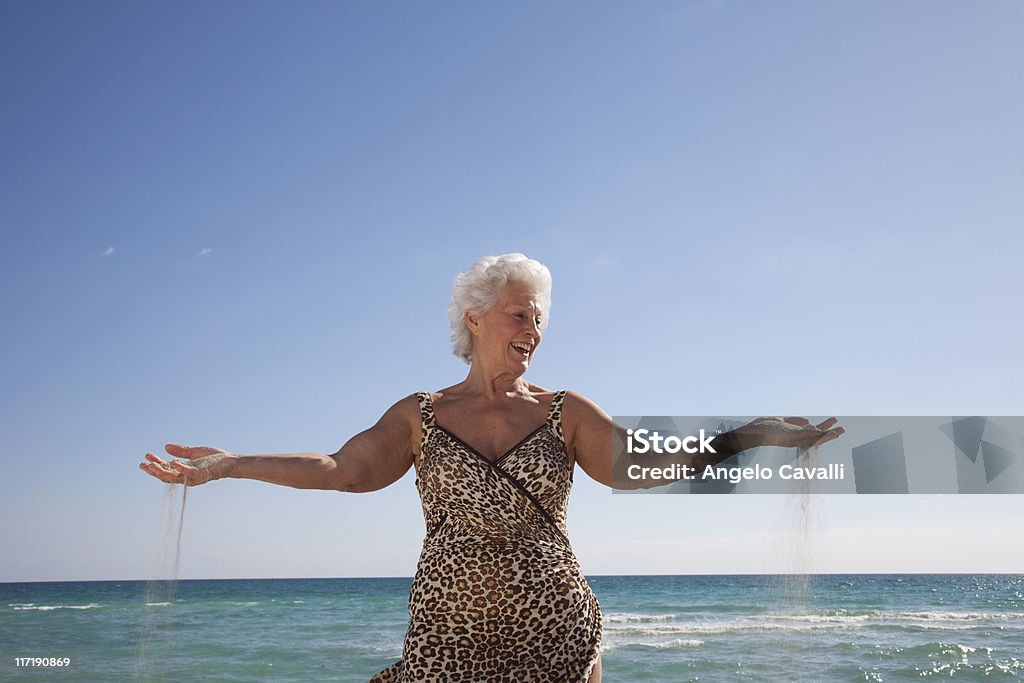 Senior Woman on the beach  Beach Stock Photo