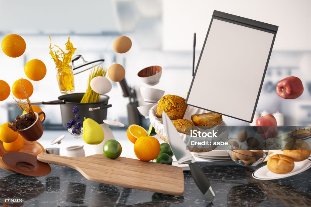 Zero Gravity Levitation in Kitchen with Empty Menu Zero gravity concept with kitchen utensil and food Food Stock Photo