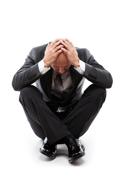 istock Crying tired or stressed businessman in depression hand hiding face 1171915627