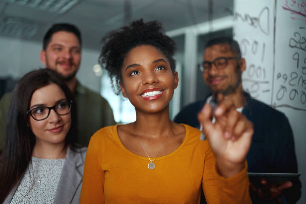 group of young successful creative multiethnic team smiling and working together in modern office - pen business person men standing imagens e fotografias de stock