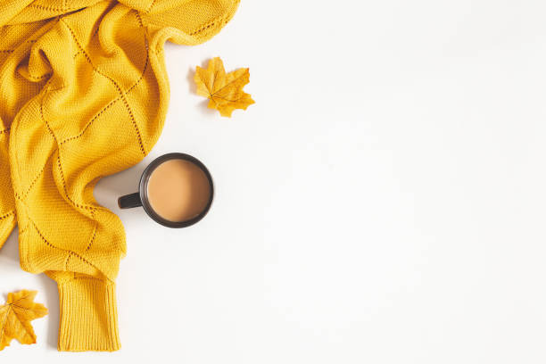 istock Autumn composition. Cup of coffee, yellow sweater on white background. Autumn, fall concept. Flat lay, top view, copy space 1171917040
