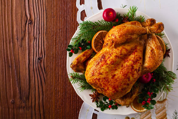 istock Roasted whole chicken with Christmas decoration. 1171917103