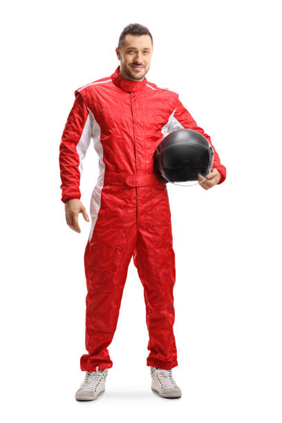 istock Racer in a red uniform holding a helmet and smiling 1171918802