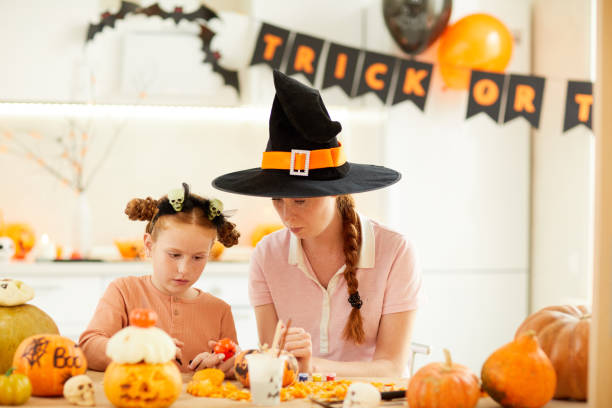 istock Mother with daughter celebrating Halloween 1171920251
