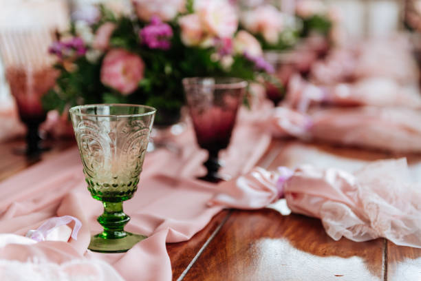 istock Vintage festive table setting with pink roses, candles and cutlery 1171921379