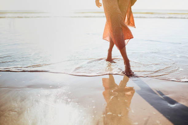 istock Young woman running on seaside path. 1171921389
