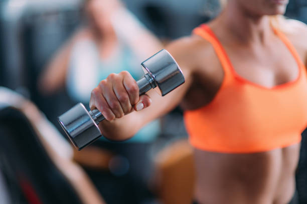 istock Female Athlete Exercising in The Gym 1171922601