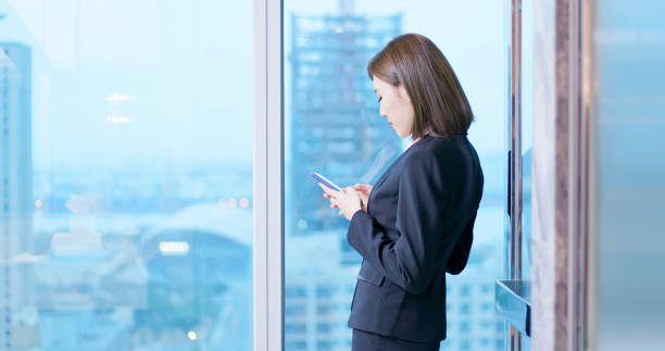 istock business woman use smartphone 1171923032