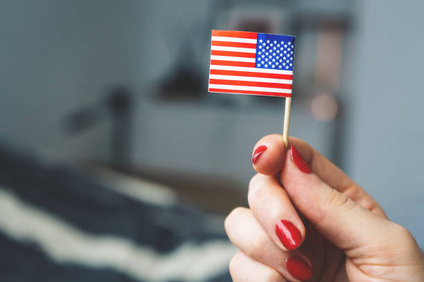 istock With American flag in her hand Independence Day 1171923191