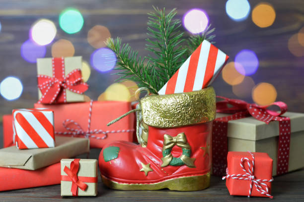 istock Santa’s shoe and wrapped gifts 1171923350