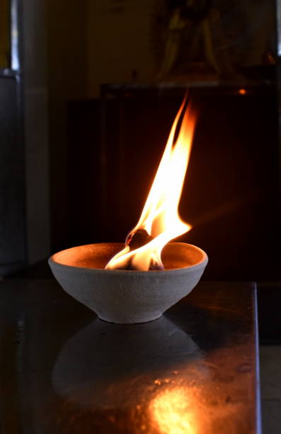 istock Prayer candle brightly burning at a Hindu temple 1171924289