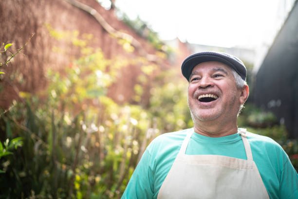 istock Senior florist working in a small flower shop 1171925999