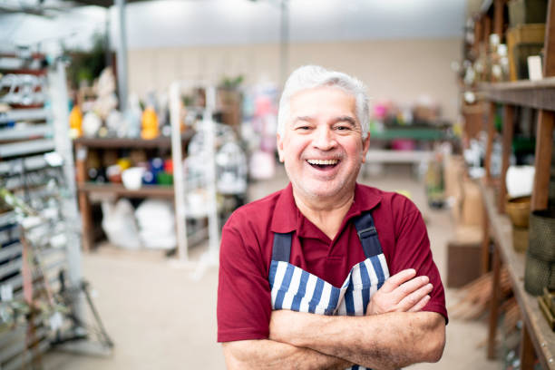 istock Senior florist standing with arms crossed 1171926350