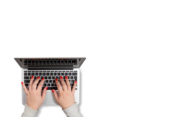 Female hands with red nails working on laptop isolated on white background. Mockup for business concept or office desktop