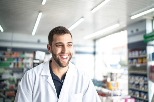 istock Happy pharmacist working in a drugstore 1171927789