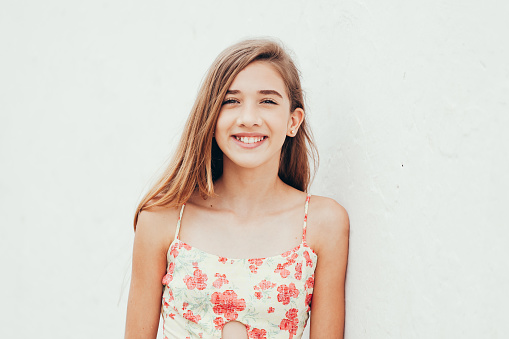 Outdoor portrait of 12 years old girl with long hair