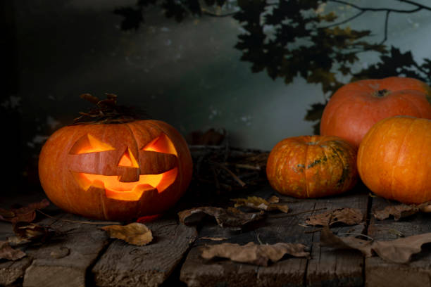 istock Halloween pumpkin glowing In a mystic  at night. 1171929198