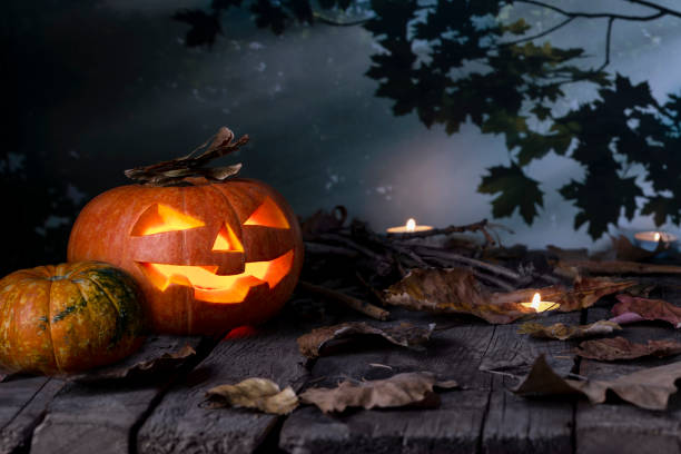 istock Halloween pumpkin glowing In a mystic  at night. 1171929232