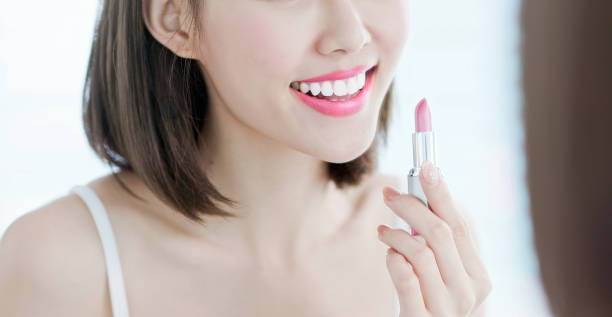 istock Beauty woman use lipstick 1171929255