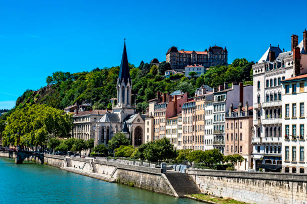 Church and apartments in Lyon Church of Eglise St. Georges on the banks of the Saone in Lyon. lyon photos stock pictures, royalty-free photos & images